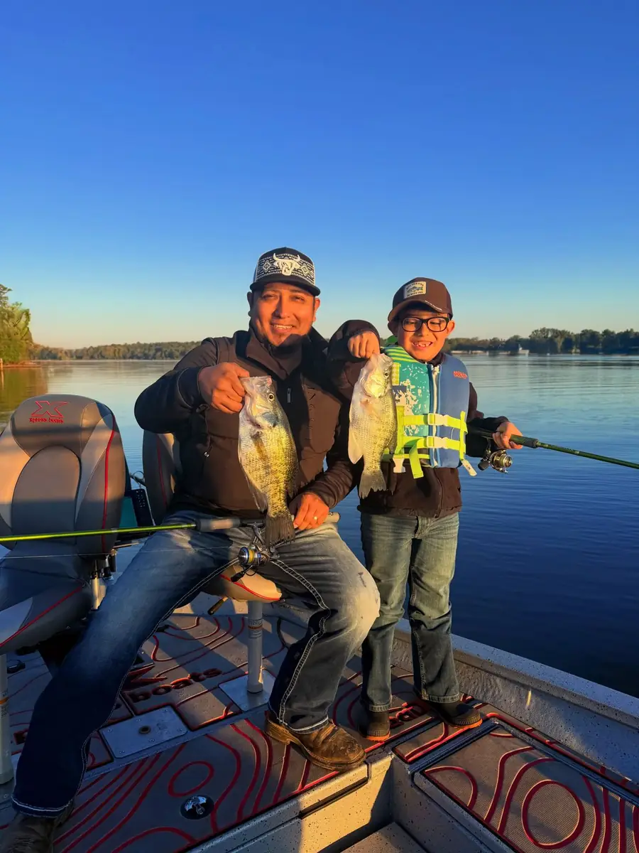 Anglers with their crappie at sundown