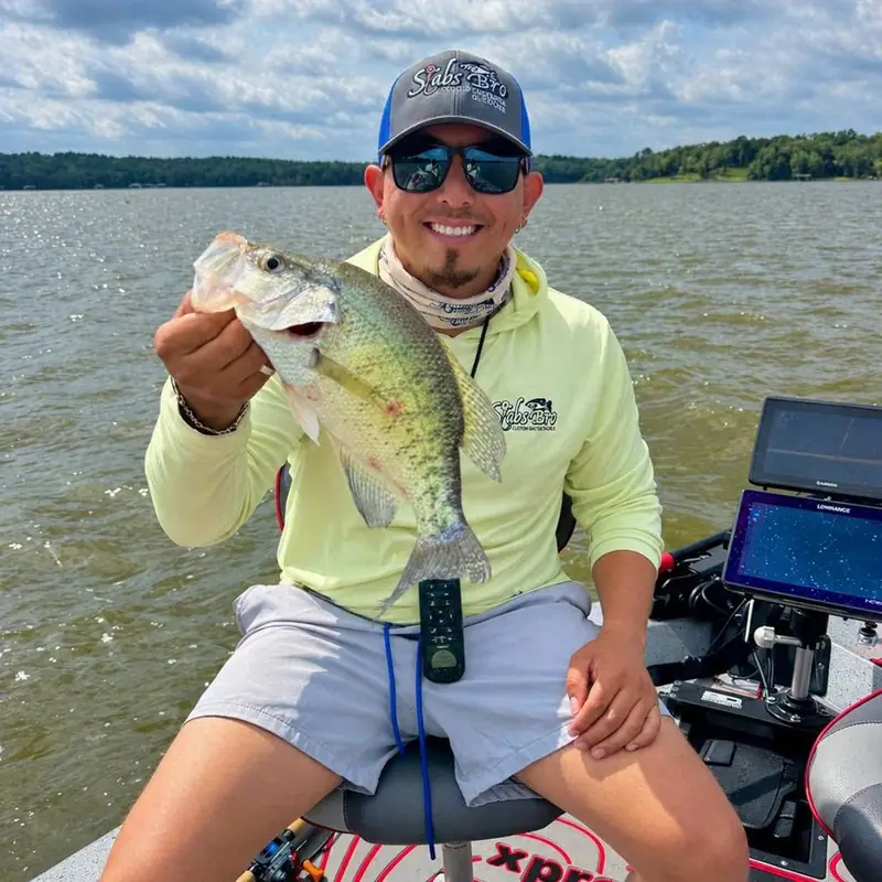 Beny holding a crappie